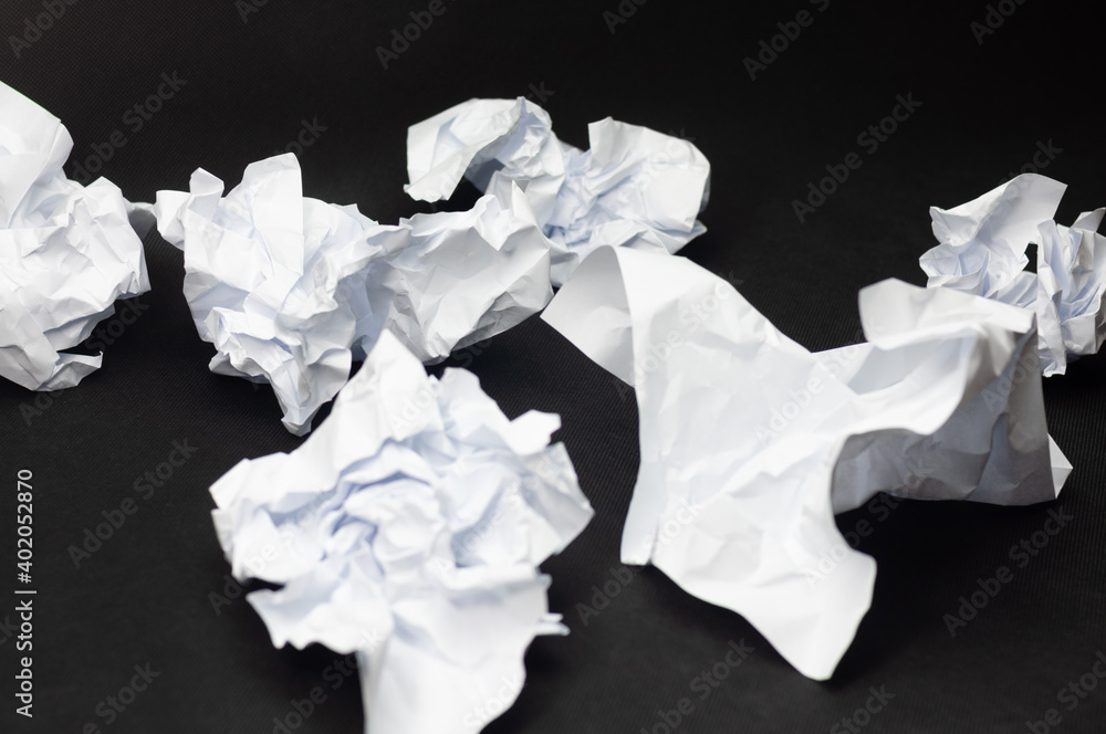 A few crumpled pieces of white paper A few crumpled pieces of white paper