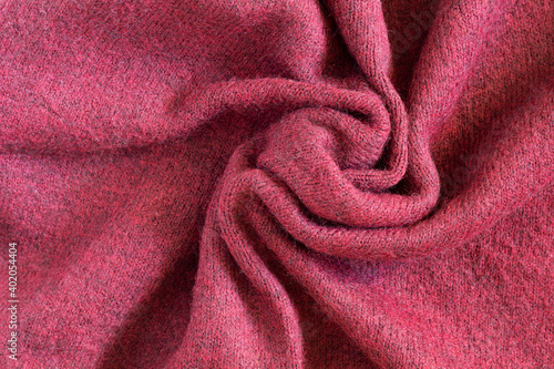 Texture of draped red warm woolen fabric