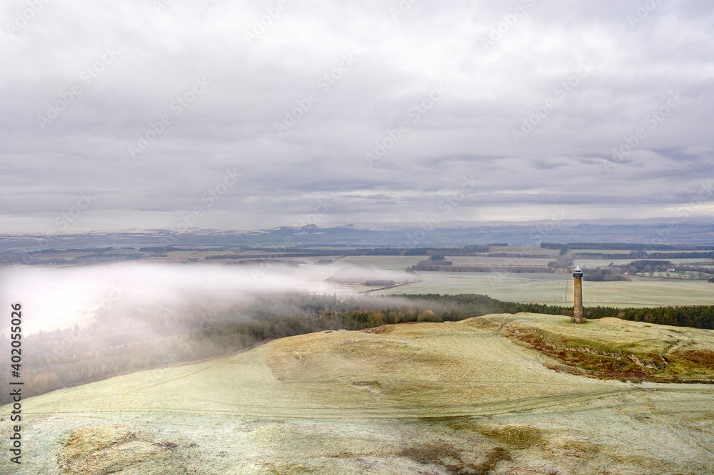 Old tower on a winter day with low lying clouds Old tower on a winter day with low lying clouds