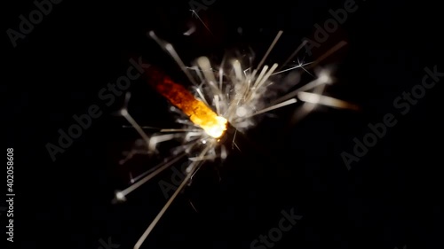 Wallpaper Mural Sparkler burns brightly against a background of bright bokeh circles. Close-up. Torontodigital.ca