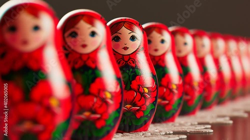 Beautiful matryoshka dolls in a row. An infinite number of babushkas on a doily. photo
