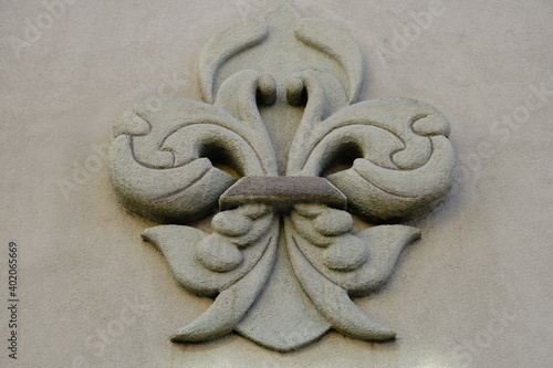 fleur de lis sculpture on a wall downtown photo