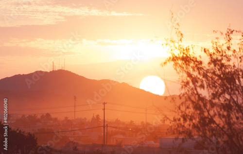 Beautiful morning sunrise behind mountains