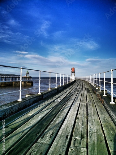 Fototapeta Naklejka Na Ścianę i Meble -  The East pier at Whitby on the North Yorkshire Coast.