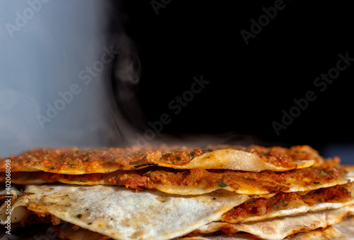 close up freshly baked and steaming traditional turkish pizza lahmacun 
