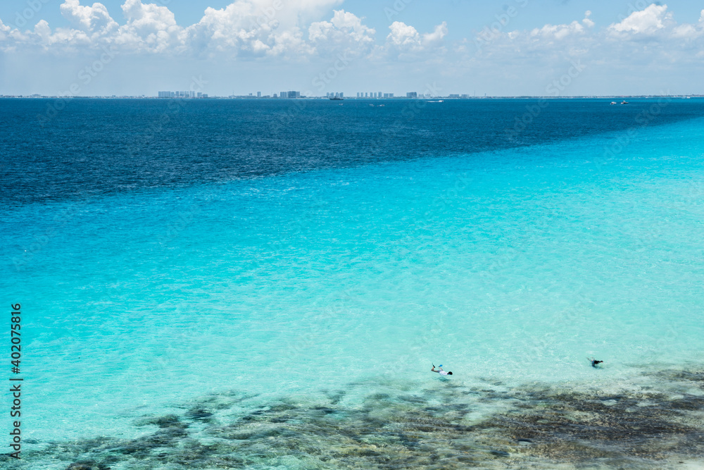 landscape of the mexican caribbean sea showing two different colors due to the difference in depth