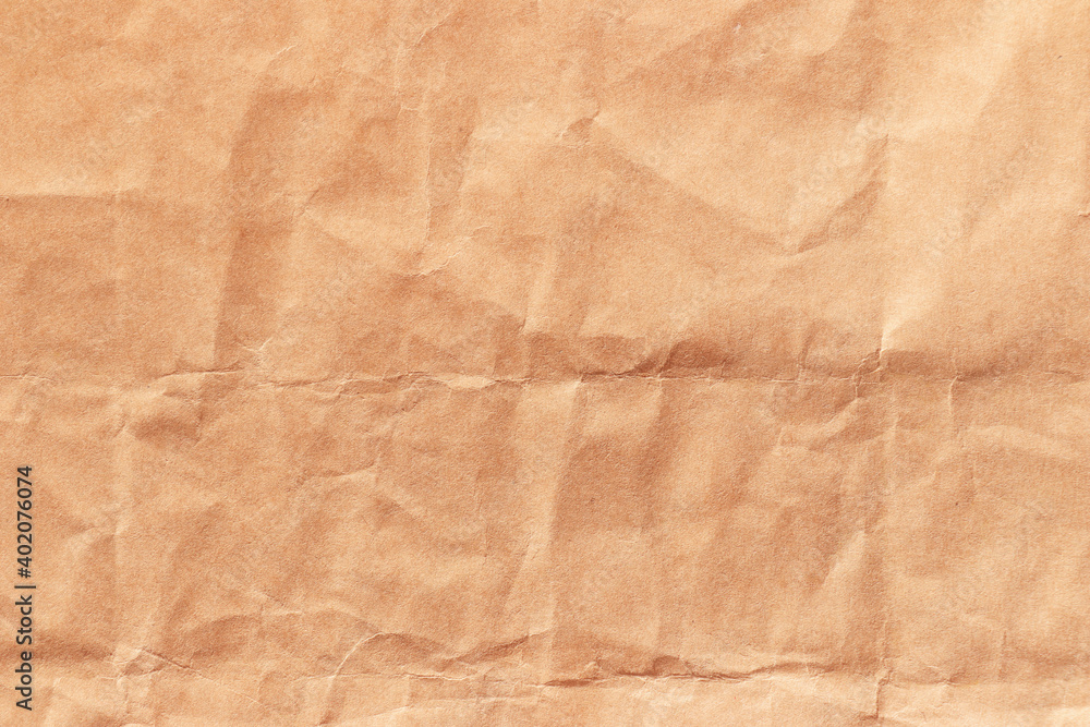 Texture of crumpled beige craft paper. Empty background. Texture of crumpled beige craft paper. Empty background.