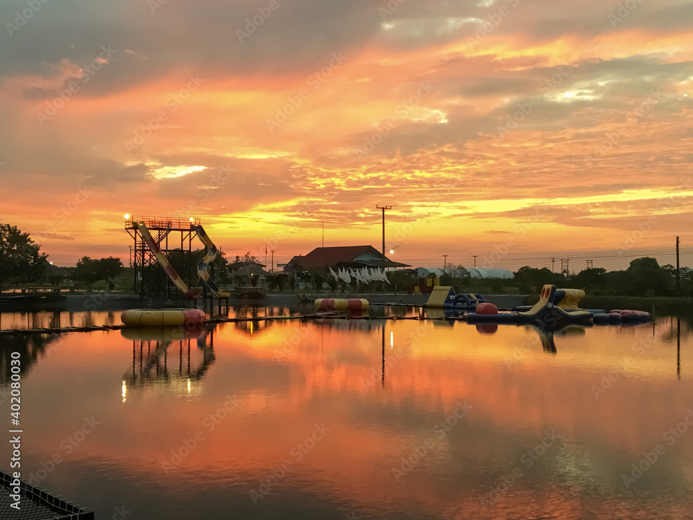 Orange evening light with a large pond.