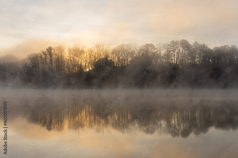 Fog on the water of Lake Lanier in Georgia, USA in winter at sunrise Fog on the water of Lake Lanier in Georgia, USA in winter at sunrise