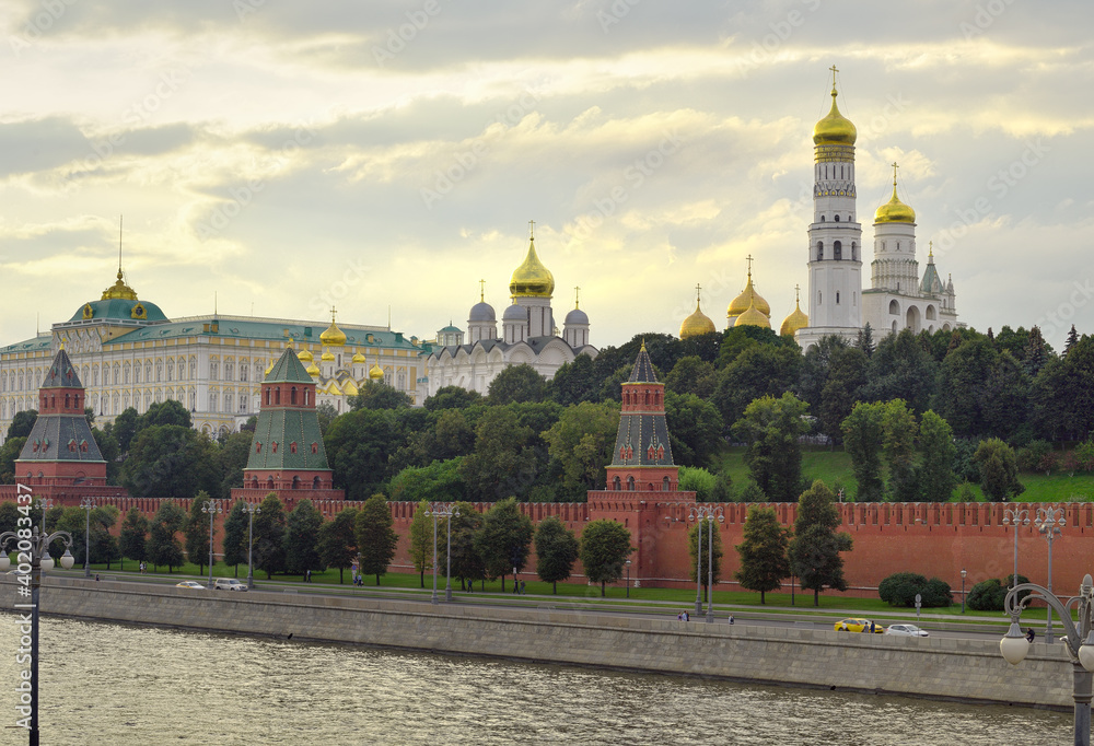 Kremlin embankment of the Moscow Kremlin in the evening. Medieval Russian architecture, white-stone cathedrals, Ivan the Great bell tower, Kremlin Palace. UNESCO monument
