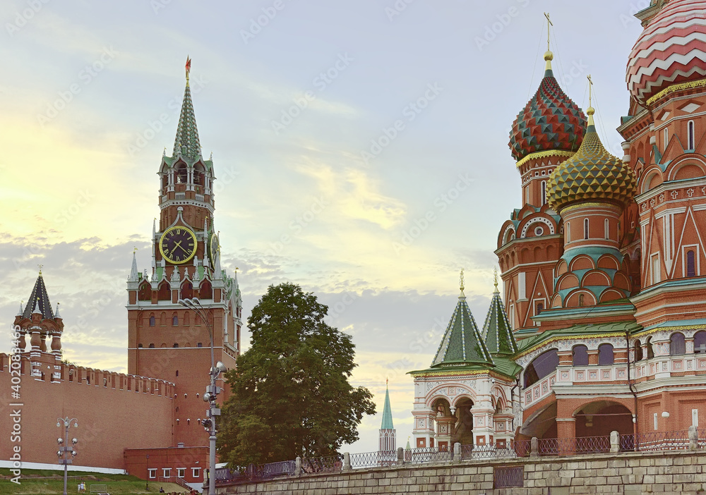 Moscow Kremlin and St. Basil's Cathedral on red square. Spasskaya tower, medieval Russian architecture, crosses on domes, beautiful decor. Brick architecture of the XV-XVII century, a UNESCO monument Moscow Kremlin and St. Basil's Cathedral on red square. Spasskaya tower, medieval Russian architecture, crosses on domes, beautiful decor. Brick architecture of the XV-XVII century, a UNESCO monument