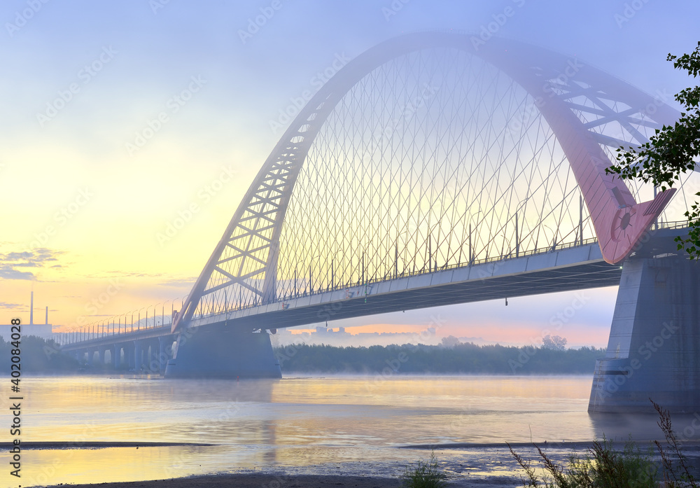 Naklejka premium Bugrinskij bridge in the morning mist. New road bridge on the banks of the great Siberian river Ob