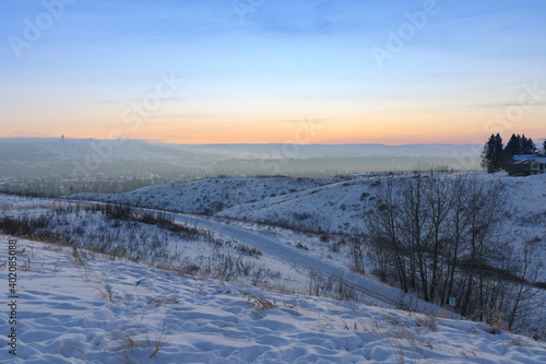 Winter landscape with snow at dusk