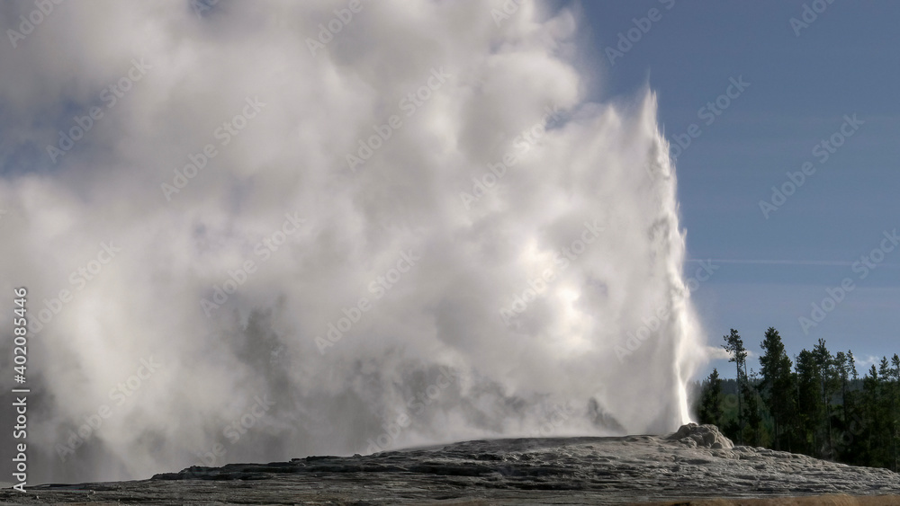 close up of old faithful erupting in yellowstone