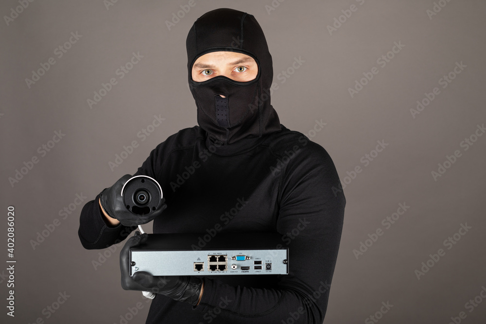 Thief turning off surveillance camera Thief turning off surveillance camera