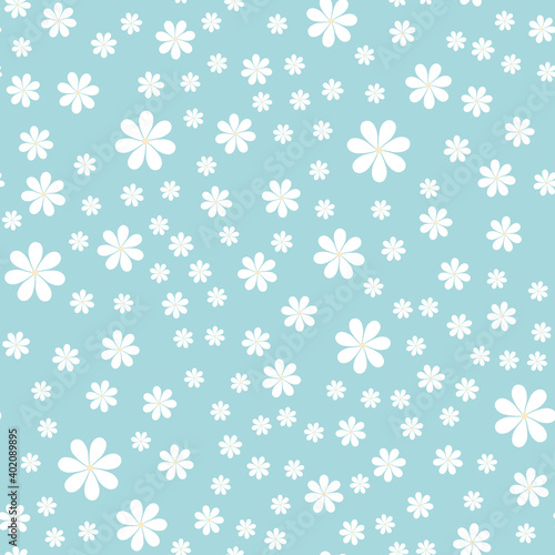 Floral pattern. White chamomileon a green background. The daisies are scattered randomly. Seamless pattern. For textiles or design. Vector illustration. Flat style.
