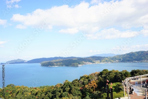 Aerial view of Amanohashidate with red and yellow foliage , Kyoto, Kansai Region, Japan - 天橋立と紅葉した山
