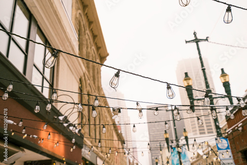 Electric bulbs christmas decorations over city streets photo