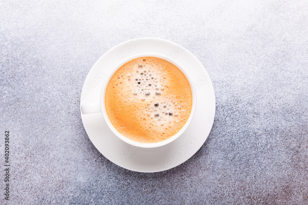White cup of coffee on stone table. Top view White cup of coffee on stone table. Top view