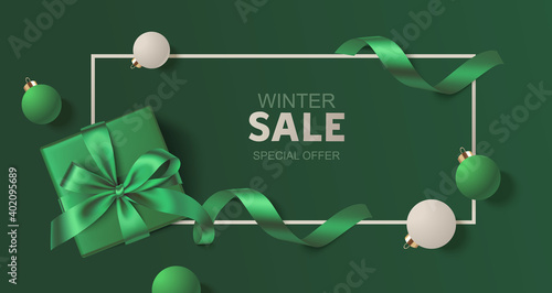 New Year and Christmas design template. Green background with decorative green and white balls, swirl ribbon and gift box. Vector stock illustration.