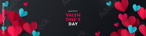 Happy Valentines Day banner. Holiday background design with frame made of pink, red, blue origami paper hearts on black fabric background. Horizontal poster, flyer, greeting card, header for website
