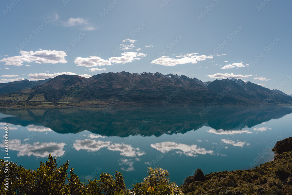 Obraz premium Amazing reflection of mountain peaks in the water of Lake Wakatipu. Glenorchy, New Zealand