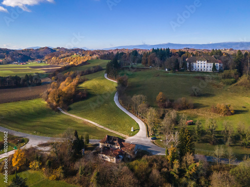 Aerial view of the landscape with Statenberg castle and mountain Pohorje in the background, Slovenia