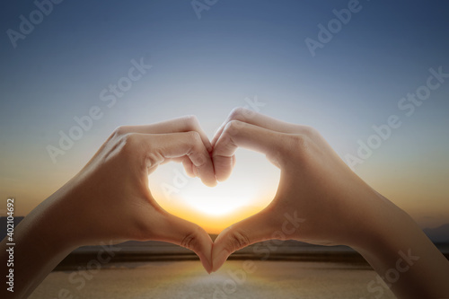 Portrait of human hands making the shape of a heart