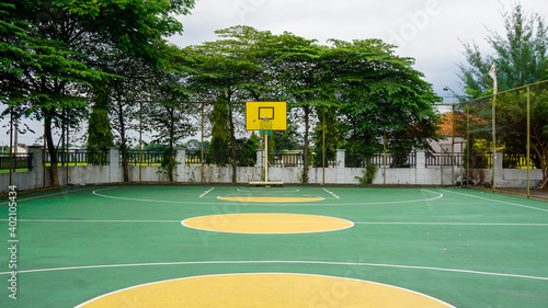 A modern and comfortable basketball court in the city of Karanganyar, Indonesia, in green and yellow colors photo