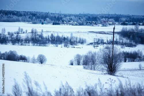 Russian village in winter, landscape in January snowfall, village houses © kichigin19