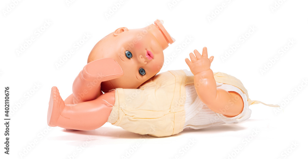 Broken old doll, isolated