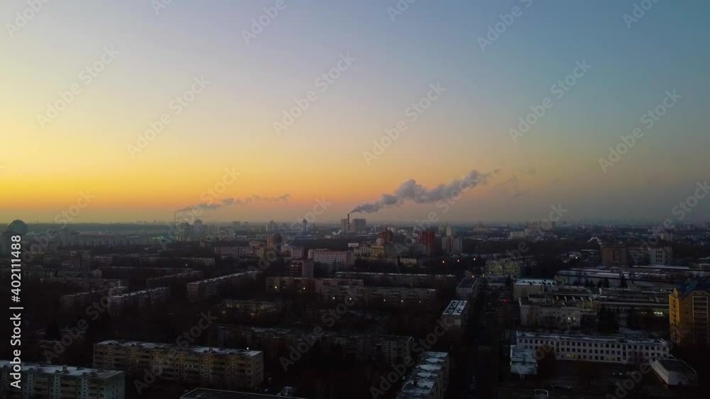 Top view of city with silhouettes of buildings and architecture at sunrise Top view of city with silhouettes of buildings and architecture at sunrise