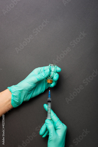 Photo of doctor hands preparing for vaccinate people. photo