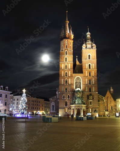 Saint Marys church in Krakow  Poland  Christmas tree  full moon