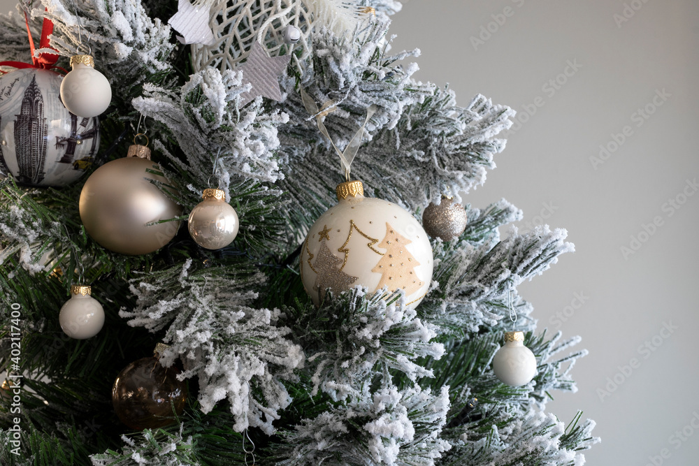 Close up of balls on christmas tree. Blurred gray background. New Year concept. Close up of balls on christmas tree. Blurred gray background. New Year concept.