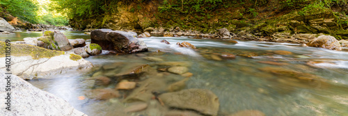Obraz na płótnie Mountain river in forest. Water on a stones w salonie