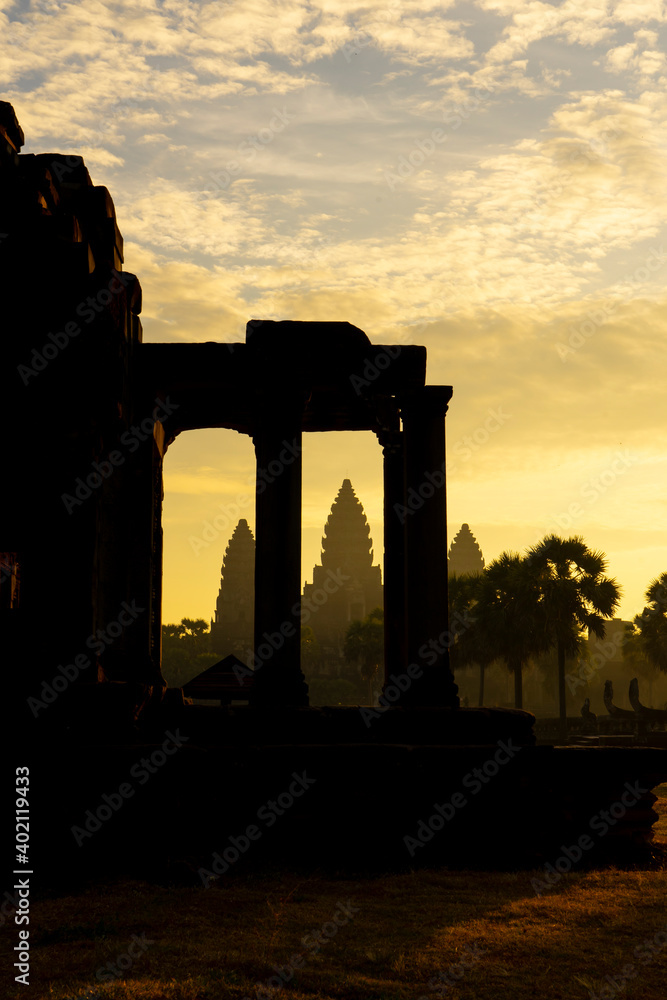 Silhouette look of Tower of Angkor wat temple in the morning with yellow cloud
