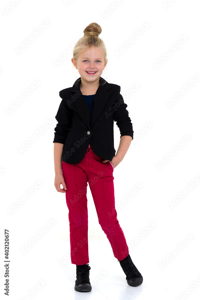 Stylish girl standing with hands on her waist