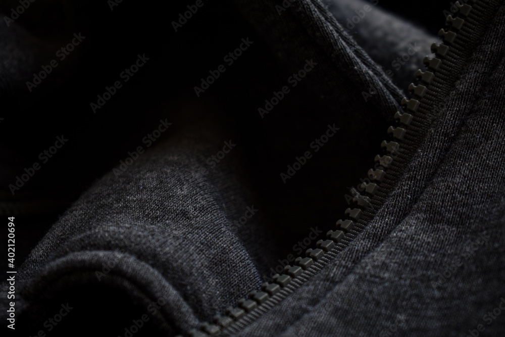 Fototapeta premium Winter is here and woolen clothes are very necessary to survive the cold weather. Wool sweater with metal buttons and plastic zip are stylish and comfy.