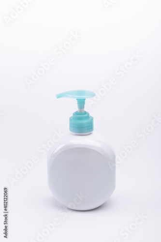 A vertical isolated closeup of spray container on a white background-concept COVID19 prevention photo