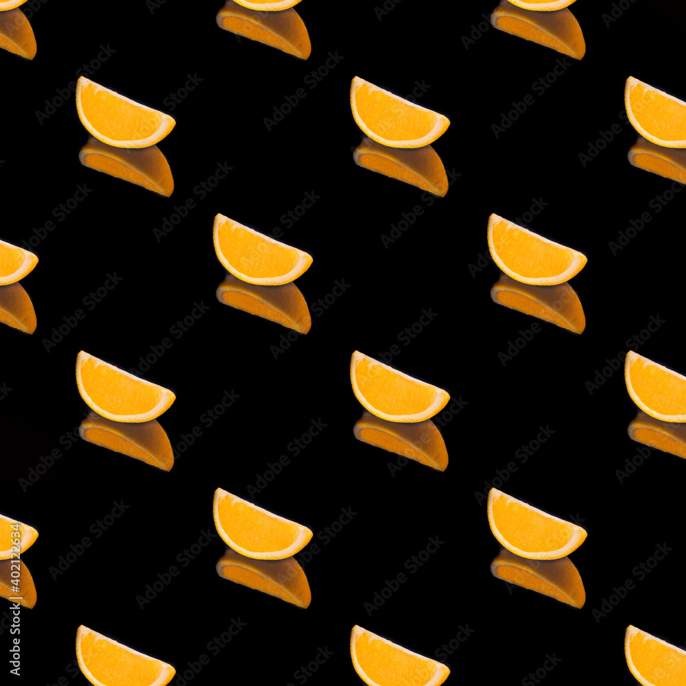 Orange sliced on black background isolated, wallpaper, texture, pattern