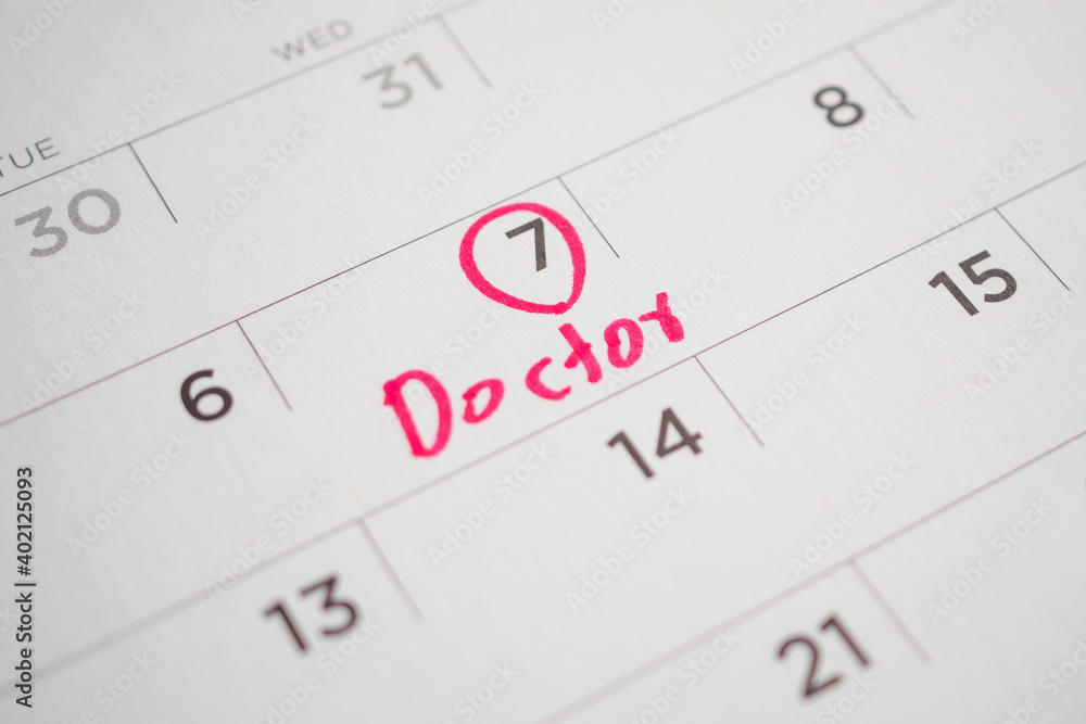 important doctor appointment schedule write on white calendar page date close up important doctor appointment schedule write on white calendar page date close up