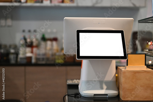 A touchscreen cashier machine with blank screen at modern coffee shop. photo