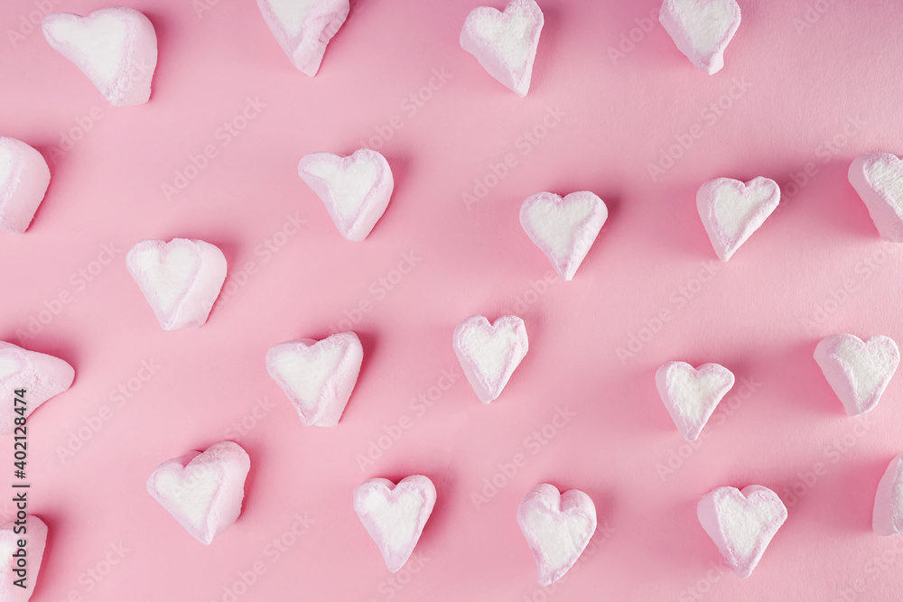 Heart shape marshmallow on pink background.