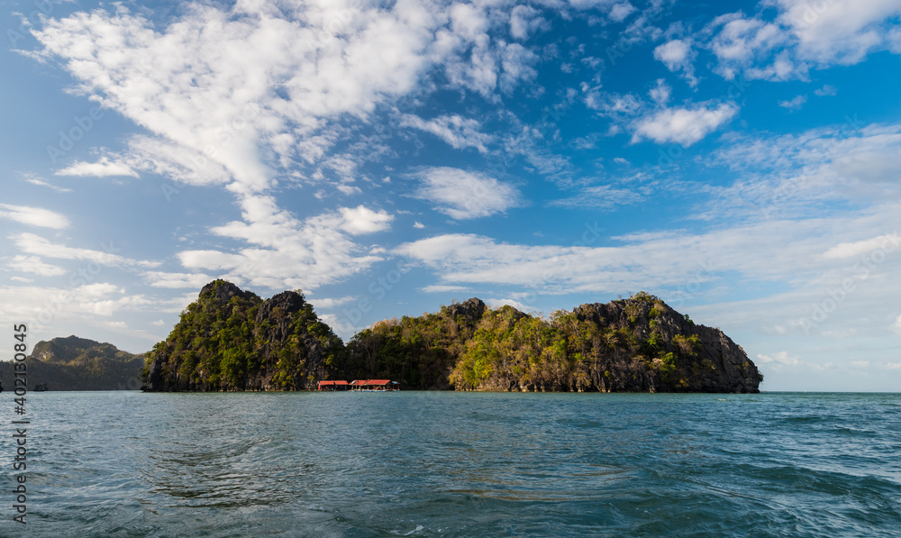 Langkawi, officially known as Langkawi, the Jewel of Kedah (Malay: Langkawi Permata Kedah), is a district and an archipelago of 99 islands (+ 5 small islands visible only at low tide) in the Andaman S