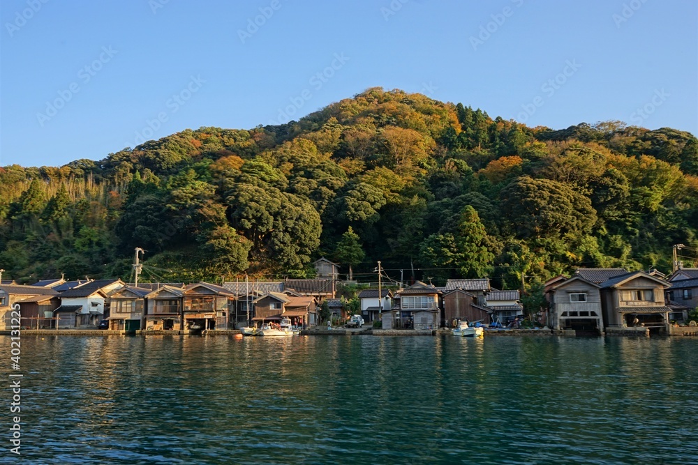 View of Funaya, boat houses, with beautiful sun light at Ine bay in Autumn , Ine city, Kyoto, Japan - 京都 伊根の舟屋 秋の景色 View of Funaya, boat houses, with beautiful sun light at Ine bay in Autumn , Ine city, Kyoto, Japan - 京都 伊根の舟屋 秋の景色