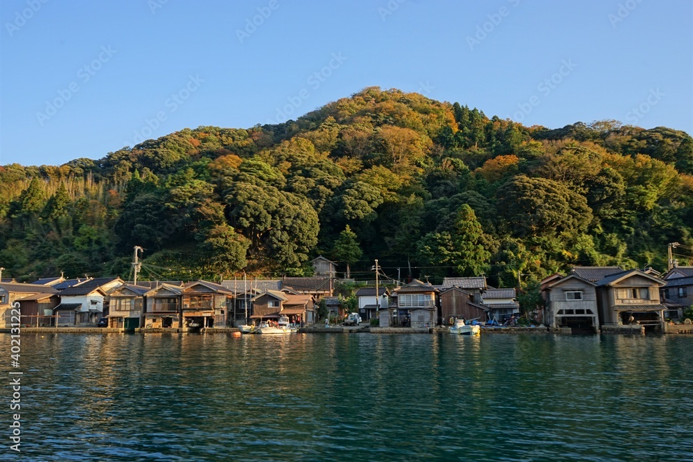 View of Funaya, boat houses, with beautiful sun light at Ine bay in Autumn , Ine city, Kyoto, Japan - 京都 伊根の舟屋 秋の景色