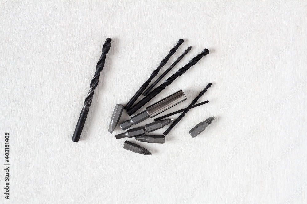 Bits and drills for a screwdriver on a white background Bits and drills for a screwdriver on a white background