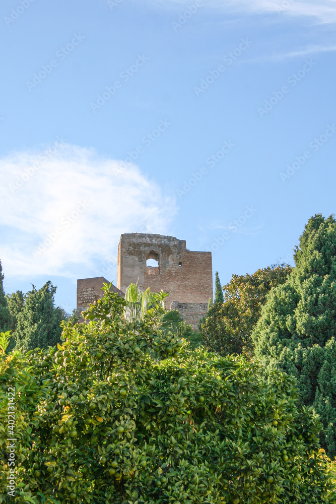 Malaga, Spain - A small broken wall made of stone, from Malaga's Castillo de Gibralfaro, Ruins of a Moorish castle fortress high atop Mount Gibralfaro.  Image has copy space.