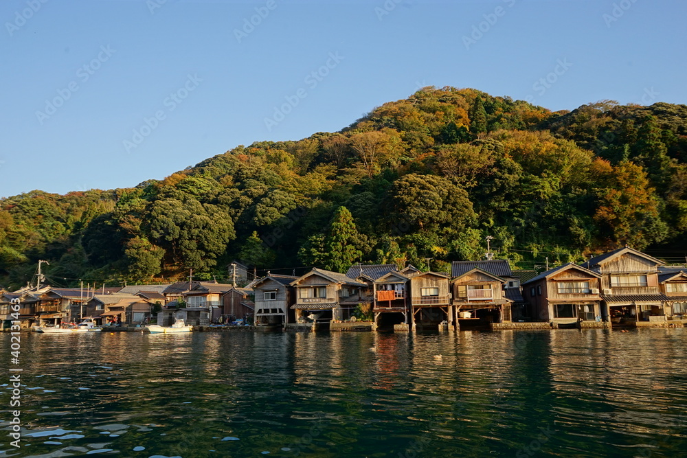 View of Funaya, boat houses, with beautiful sun light at Ine bay in Autumn , Ine city, Kyoto, Japan - 京都 伊根の舟屋 秋の景色